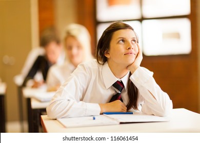 high school girl daydreaming in classroom - Powered by Shutterstock