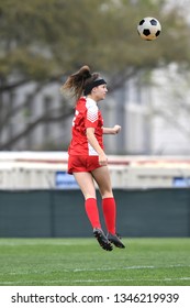 High School Girl Playing Soccer, Kicking The Ball.