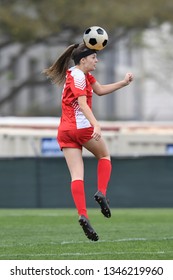 High School Girl Playing Soccer, Kicking The Ball.