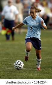 High School Girl Soccer Player About To Make A Move With The Soccer Ball