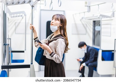 A High School Girl Wearing A Mask On The Train