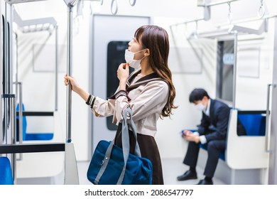 A High School Girl Wearing A Mask On The Train