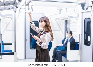 High school girls commuting to school by train