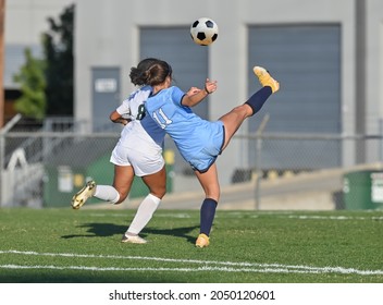 High School Girls Competing In A Soccer Match In South Texas