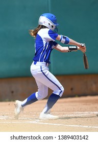 High School Girls Making Plays During A Softball Game