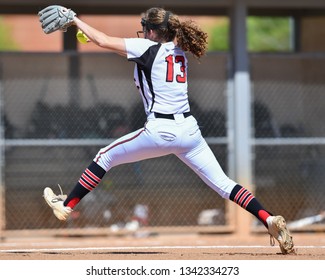 High School Girls Playing In A Softball Game