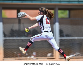 High School Girls Playing In A Softball Game