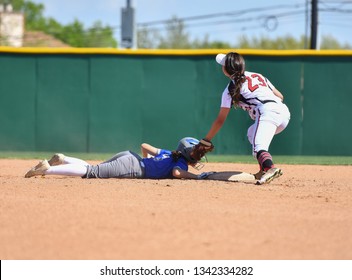 High School Girls Playing In A Softball Game