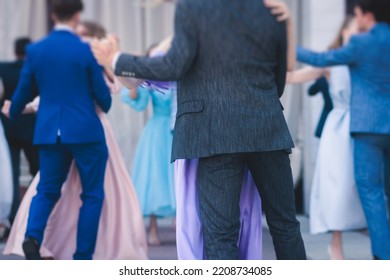 High school graduates dancing waltz and classical ball dance in dresses and suits on school prom graduation, classical ballroom dancers dancing, waltz, quadrille and polonaise - Shutterstock ID 2208734085