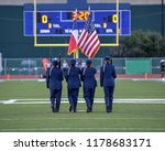 High School JROTC team presenting the colors at a football game