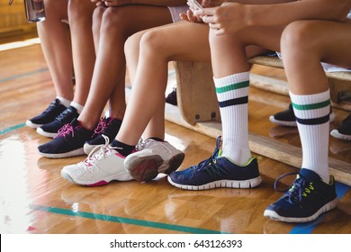 High School Kids Sitting On The Bench In Basketball Court