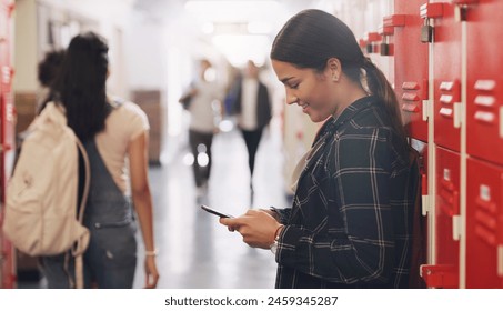 High school, locker and phone with student girl in hallway for communication, networking or text message. App, social media and smile with happy learner or pupil in corridor for education and study - Powered by Shutterstock