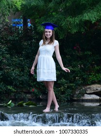 High School Senior Posing For Senior Pictures At A Local Water Park