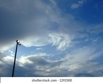 High School Stadium Lights Against Sky