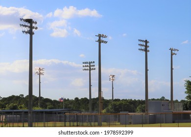 High School Stadium Lights With Blue Sky And White Clouds