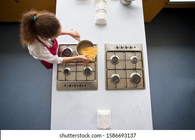 High School Student Cooking Pasta In Home Economics Class