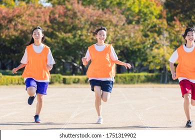 High School Student Running On The Ground