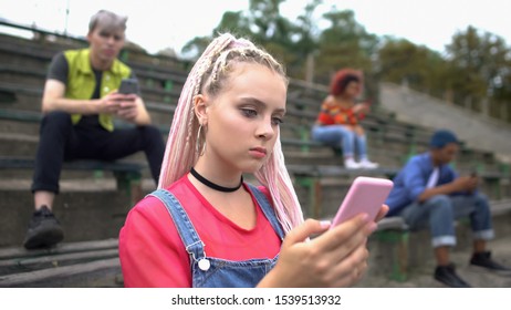 High School Student Scrolling Social Networks Photo Holding Smartphone 