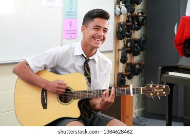 The High School Student Shows His Talent For Visitors Who Observe The Musical Classroom, Brisbane - Australia, 30 April 2019 