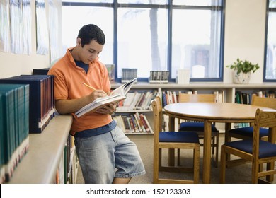 High School Student Studying In Library