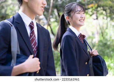 high school student walking in the park