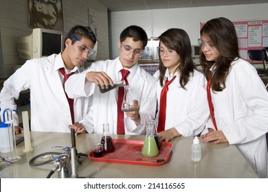 High School Students Conducting Science Experiment