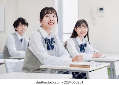 High school students enjoying class in a classroom - Shutterstock ID 2284050251