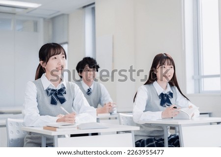 High school students enjoying class in a classroom