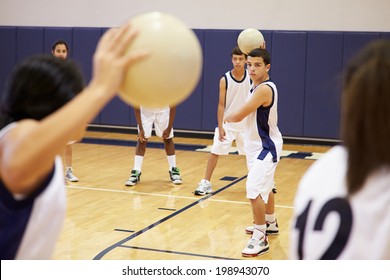 High School Students Playing Dodge Ball In Gym - Shutterstock ID 198943070