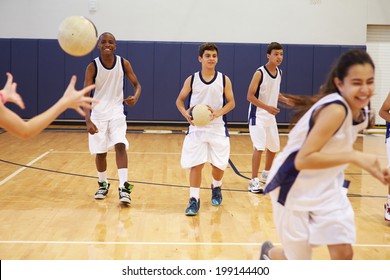 High School Students Playing Dodge Ball In Gym - Shutterstock ID 199144400