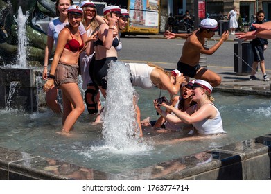 High School Students Playing In The Fountain Celebrating Graduating From High School In Arhus, Denmark On 25 June 2020