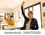 In high school, students raising hands to answer question in classroom, engaging actively. Education, learning, engagement, participation, raise hand, teacher