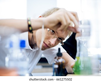 High School Students Studying In Chemistry Laboratory Experiment Class