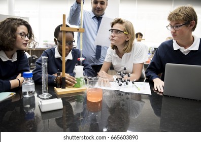 High School Students Studying Chemistry Laboratory Experiment Class