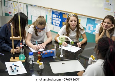 High School Students Studying In Chemistry Laboratory Experiment Class