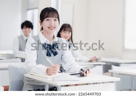 High school students taking a class on a tablet device