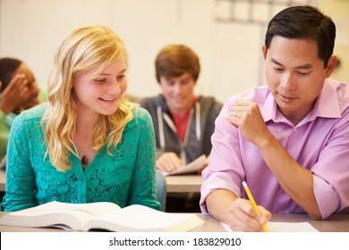 High School Teacher Helping Student Written Stock Photo 183829010 ...