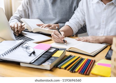 High School Tutor Or College Student Group Sitting At Desk In Library Studying And Reading, Doing Homework And Lesson Practice Preparing Exam To Entrance, Education, Teaching, Learning Concept.