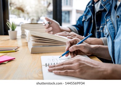 High School Tutor Or College Student Group Sitting At Desk In Library Studying And Reading, Doing Homework And Lesson Practice Preparing Exam To Entrance, Education, Teaching, Learning Concept.