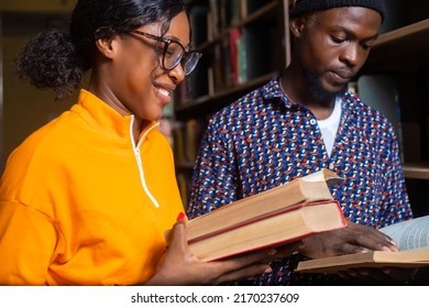 High school - two students with book in classroom - Shutterstock ID 2170237609