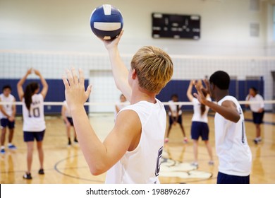 High School Volleyball Match In Gymnasium