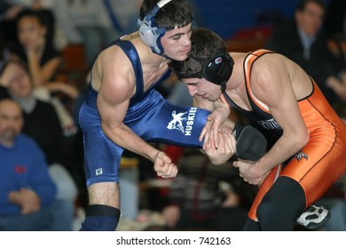 High School Wrestlers Competing. Editorial Use Only.