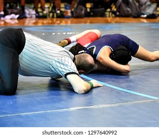 High School Wrestlers Competing At A Wrestling Meet.