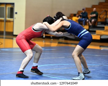 High School Wrestlers Competing At A Wrestling Meet.