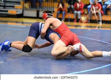 High School Wrestlers Competing At A Wrestling Meet.