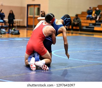 High School Wrestlers Competing At A Wrestling Meet.