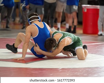 High School Wrestlers Competing At A Wrestling Meet