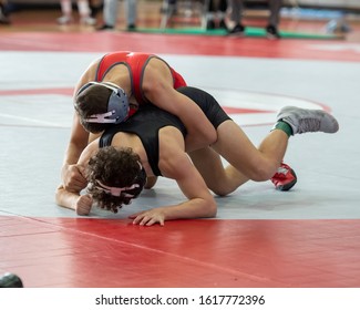 High School Wrestlers Competing At A Wrestling Meet