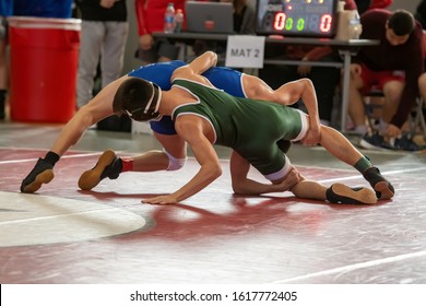 High School Wrestlers Competing At A Wrestling Meet