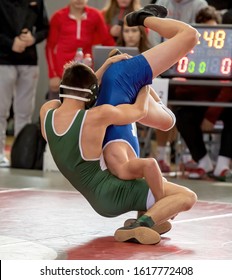 High School Wrestlers Competing At A Wrestling Meet